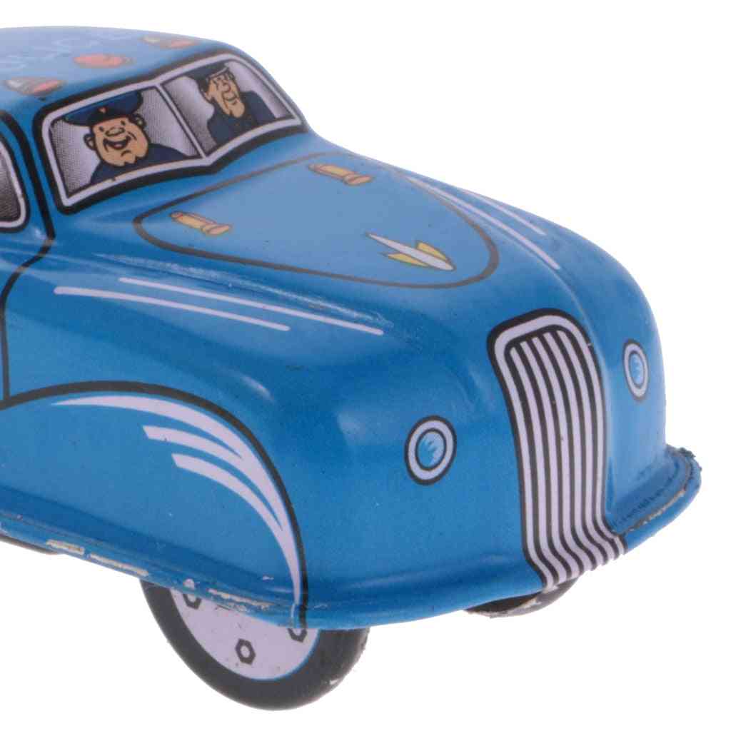 Starinski policijski model automobila, vitka dječja limena igračka koja se navija
