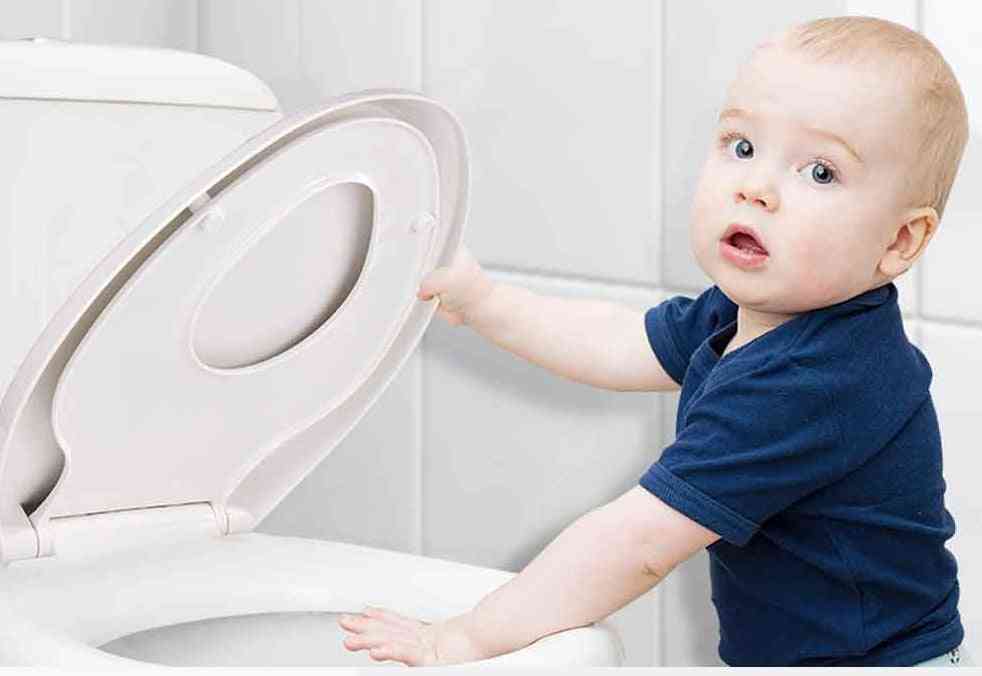 Ouv-formet voksen toiletsæde til barnet med træningsovertræk til barnepotte