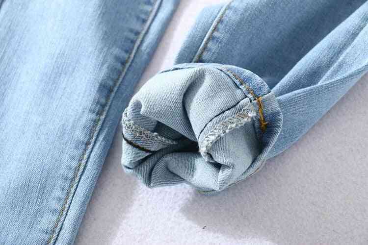 Jeans ajustados de cuatro botones de cintura alta, pantalones ajustados elásticos para mujer