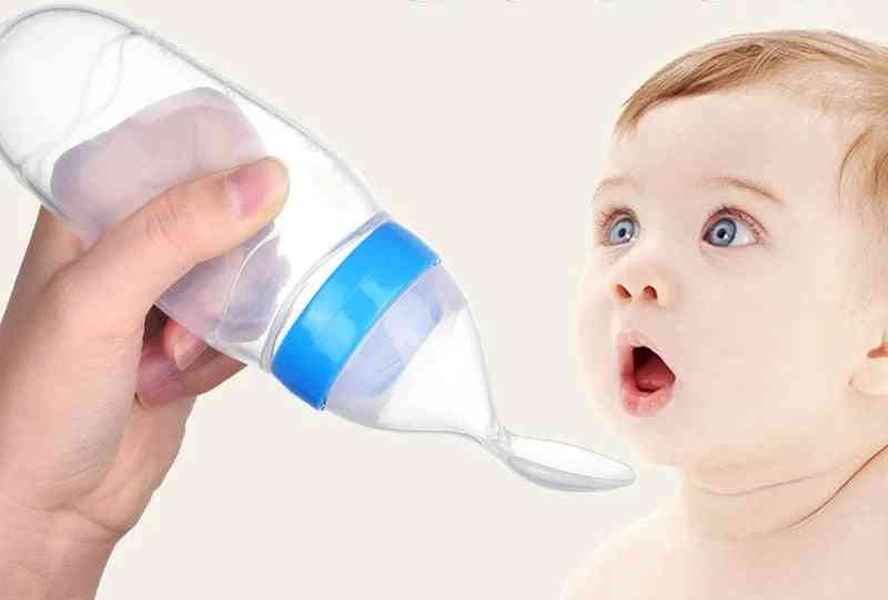 Butelka do karmienia dziecka, łyżeczka mleka, karmnik treningowy
